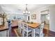 Charming dining room with a rustic farmhouse table and chandelier at 1230 Nelson St, Dunedin, FL 34698