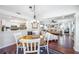 Open dining room with view of the living room and kitchen at 1230 Nelson St, Dunedin, FL 34698