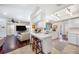 Bright kitchen with breakfast bar and view into living room at 1230 Nelson St, Dunedin, FL 34698