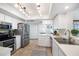 Modern kitchen with stainless steel appliances and white cabinetry at 1230 Nelson St, Dunedin, FL 34698