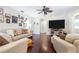 Spacious living room showcasing hardwood floors and comfy seating at 1230 Nelson St, Dunedin, FL 34698