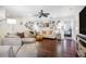 Relaxing living room with hardwood floors and a wall of Gathering photos at 1230 Nelson St, Dunedin, FL 34698