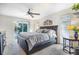 Bright bedroom with sliding door to the pool area at 1230 Nelson St, Dunedin, FL 34698