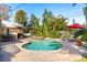 Enjoy this large kidney shaped pool with spa and brick pavers at 1230 Nelson St, Dunedin, FL 34698