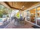 Relaxing screened patio with seating area, overlooking the pool at 1230 Nelson St, Dunedin, FL 34698