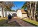 Convenient storage shed and grill area in backyard at 1230 Nelson St, Dunedin, FL 34698