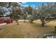 Large grassy backyard with mature oak trees at 1290 83Rd N Ave # D, St Petersburg, FL 33702