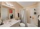 Clean bathroom with tub and shower, vanity, and mirror at 1290 83Rd N Ave # D, St Petersburg, FL 33702