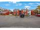 Red brick building exterior with parking lot at 1290 83Rd N Ave # D, St Petersburg, FL 33702