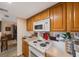 White appliances and oak cabinets in this kitchen at 1290 83Rd N Ave # D, St Petersburg, FL 33702