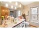 Bright bathroom with updated vanity, decorative accents, and a glass-block window at 13494 Tyringham St, Spring Hill, FL 34609