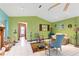 Living area with blue and green walls and a fireplace at 13494 Tyringham St, Spring Hill, FL 34609