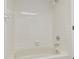 Clean bathroom with a shower/tub combo and white tile at 13602 S Village Dr # 1112, Tampa, FL 33618