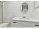 Bathroom with white vanity, quartz countertop at 13602 S Village Dr # 1112, Tampa, FL 33618