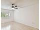 Spacious bedroom with ceiling fan and large window at 13602 S Village Dr # 1112, Tampa, FL 33618