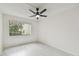 Bright bedroom with ceiling fan and wood-look floors at 13602 S Village Dr # 1112, Tampa, FL 33618