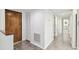 Clean entryway with wood-look floors and built-in storage at 13602 S Village Dr # 1112, Tampa, FL 33618