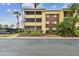 Condo building exterior with palm trees at 13602 S Village Dr # 1112, Tampa, FL 33618