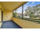 Private screened balcony offers tranquil views of the surrounding area at 13602 S Village Dr # 1112, Tampa, FL 33618