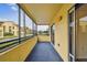 Screened-in porch with view of the community at 13602 S Village Dr # 1112, Tampa, FL 33618