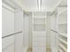 Large walk-in closet with shelves and hanging rods at 13602 S Village Dr # 1112, Tampa, FL 33618