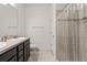 Clean bathroom with double vanity and shower/tub combo at 15579 Stone House Dr, Brooksville, FL 34604