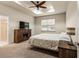 Comfortable bedroom with a queen-size bed and built-in fireplace at 15579 Stone House Dr, Brooksville, FL 34604