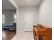 Bright entryway with tiled floor and a wooden piano at 15579 Stone House Dr, Brooksville, FL 34604