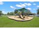 Community playground with shaded play area and slides at 15579 Stone House Dr, Brooksville, FL 34604