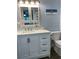 Updated bathroom with white vanity and quartz countertop at 1600 Pennsylvania Ne Ave, St Petersburg, FL 33703