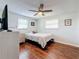 Bedroom with a double bed, hardwood floors, and ceiling fan at 1600 Pennsylvania Ne Ave, St Petersburg, FL 33703