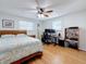 Bedroom with a double bed, built-in desk and hardwood floors at 1600 Pennsylvania Ne Ave, St Petersburg, FL 33703