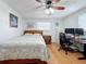 Bedroom with a double bed, workspace, and hardwood floors at 1600 Pennsylvania Ne Ave, St Petersburg, FL 33703