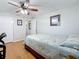 Bedroom with a double bed, workspace, and hardwood floors at 1600 Pennsylvania Ne Ave, St Petersburg, FL 33703