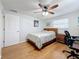 Bedroom with a double bed, workspace, and hardwood floors at 1600 Pennsylvania Ne Ave, St Petersburg, FL 33703