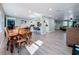 Bright dining area with hardwood floors and a view into the living room at 1600 Pennsylvania Ne Ave, St Petersburg, FL 33703