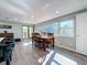 Bright dining room with wood table and access to a deck at 1600 Pennsylvania Ne Ave, St Petersburg, FL 33703