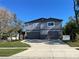 Two-story house with double garage, stone accents, and landscaping at 1600 Pennsylvania Ne Ave, St Petersburg, FL 33703