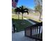 Residential front yard with palm trees, grass, and walkway at 1600 Pennsylvania Ne Ave, St Petersburg, FL 33703