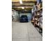 Garage with epoxy flooring, shelving, and room for a car and storage at 1600 Pennsylvania Ne Ave, St Petersburg, FL 33703