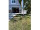 Attached garage with stone accents and a well-maintained lawn at 1600 Pennsylvania Ne Ave, St Petersburg, FL 33703