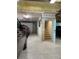 Garage with epoxy flooring, interior stairs, and parking space at 1600 Pennsylvania Ne Ave, St Petersburg, FL 33703