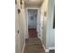 Light and bright hallway with wood-look flooring and access to other rooms at 1600 Pennsylvania Ne Ave, St Petersburg, FL 33703