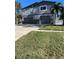 Two-story house exterior, double garage, stone accents, and landscaping at 1600 Pennsylvania Ne Ave, St Petersburg, FL 33703