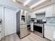 Updated kitchen featuring stainless steel appliances and white cabinets at 1600 Pennsylvania Ne Ave, St Petersburg, FL 33703