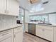 Modern kitchen with stainless steel appliances and an island with seating at 1600 Pennsylvania Ne Ave, St Petersburg, FL 33703