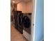 Laundry room with washer, dryer, and ample storage space at 1600 Pennsylvania Ne Ave, St Petersburg, FL 33703