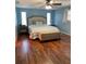 Large bedroom with light blue walls, king-size bed, and ample closet space at 1600 Pennsylvania Ne Ave, St Petersburg, FL 33703