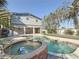 Relaxing pool and spa surrounded by lush landscaping at 1600 Pennsylvania Ne Ave, St Petersburg, FL 33703