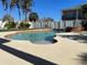 Freeform swimming pool with a spa, and a spacious patio area at 1600 Pennsylvania Ne Ave, St Petersburg, FL 33703